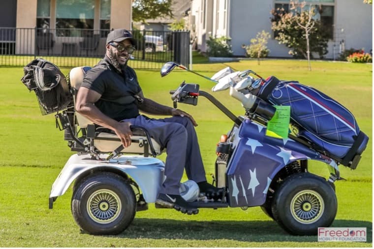 Karlton at the 2024 Veterans Day Golf Challenge in a Solo Rider